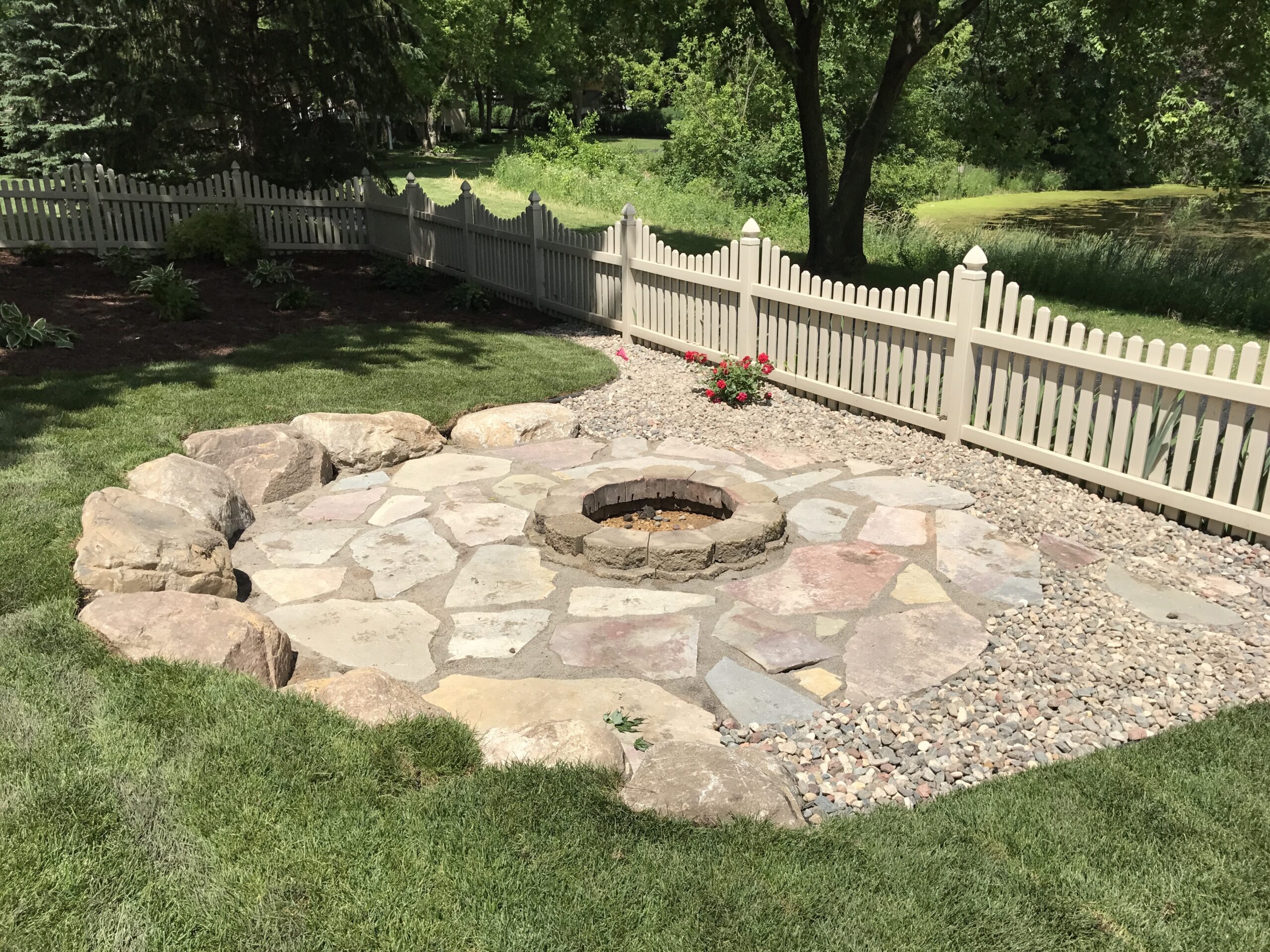 Patio and fire pit project by North Ridge Outdoor Services