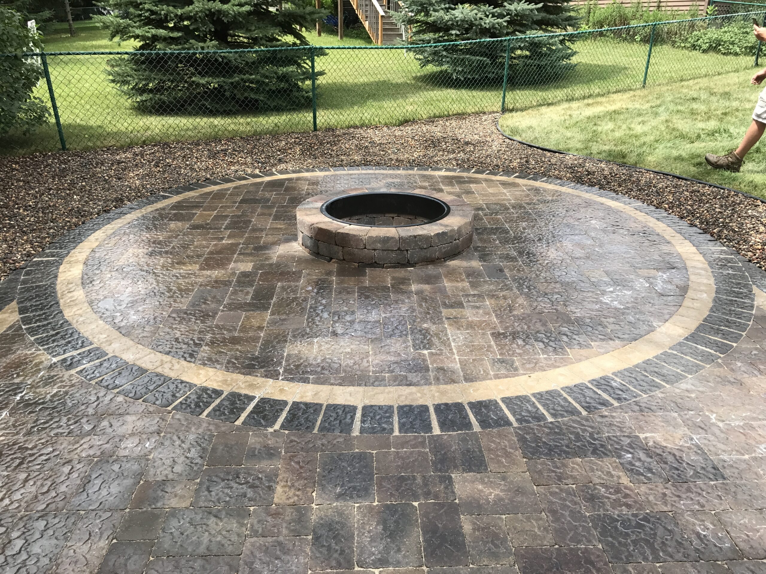 Patio and fire pit project by North Ridge Outdoor Services
