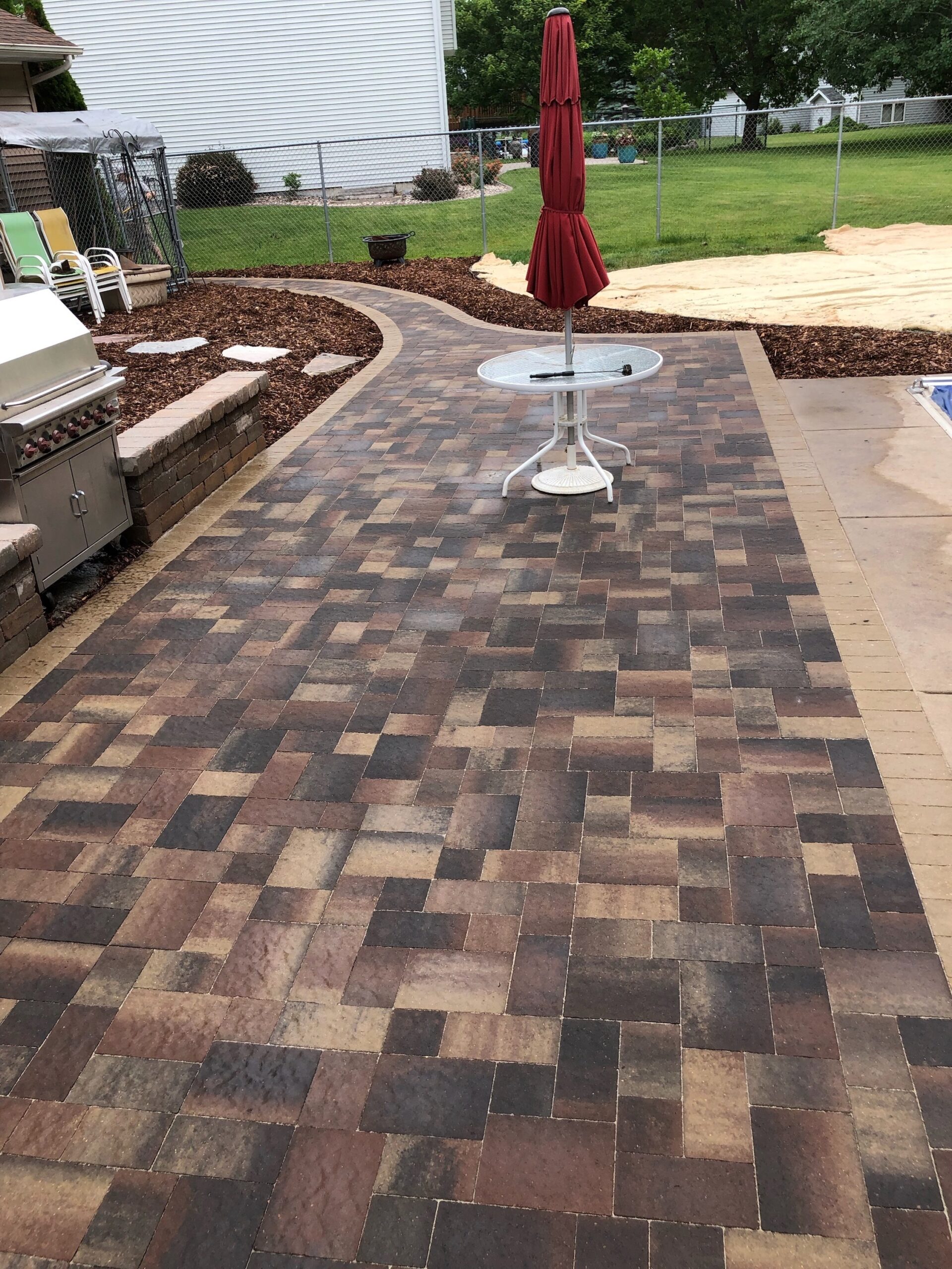 Patio and fire pit project by North Ridge Outdoor Services