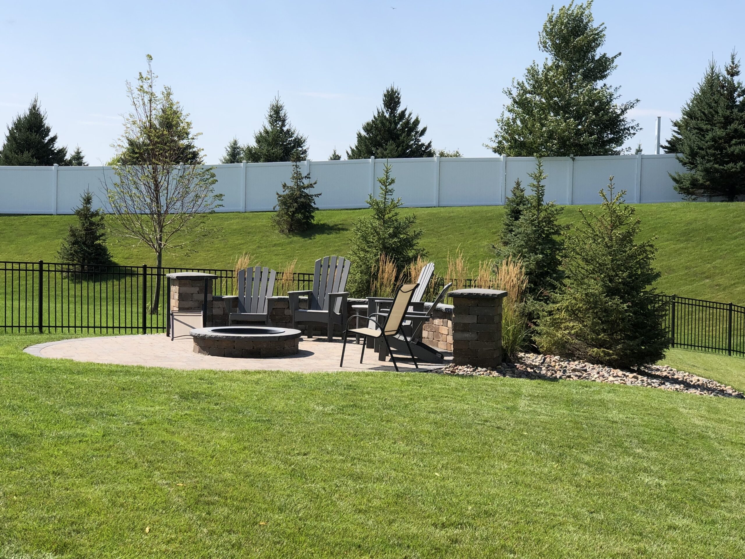 Patio and fire pit project by North Ridge Outdoor Services