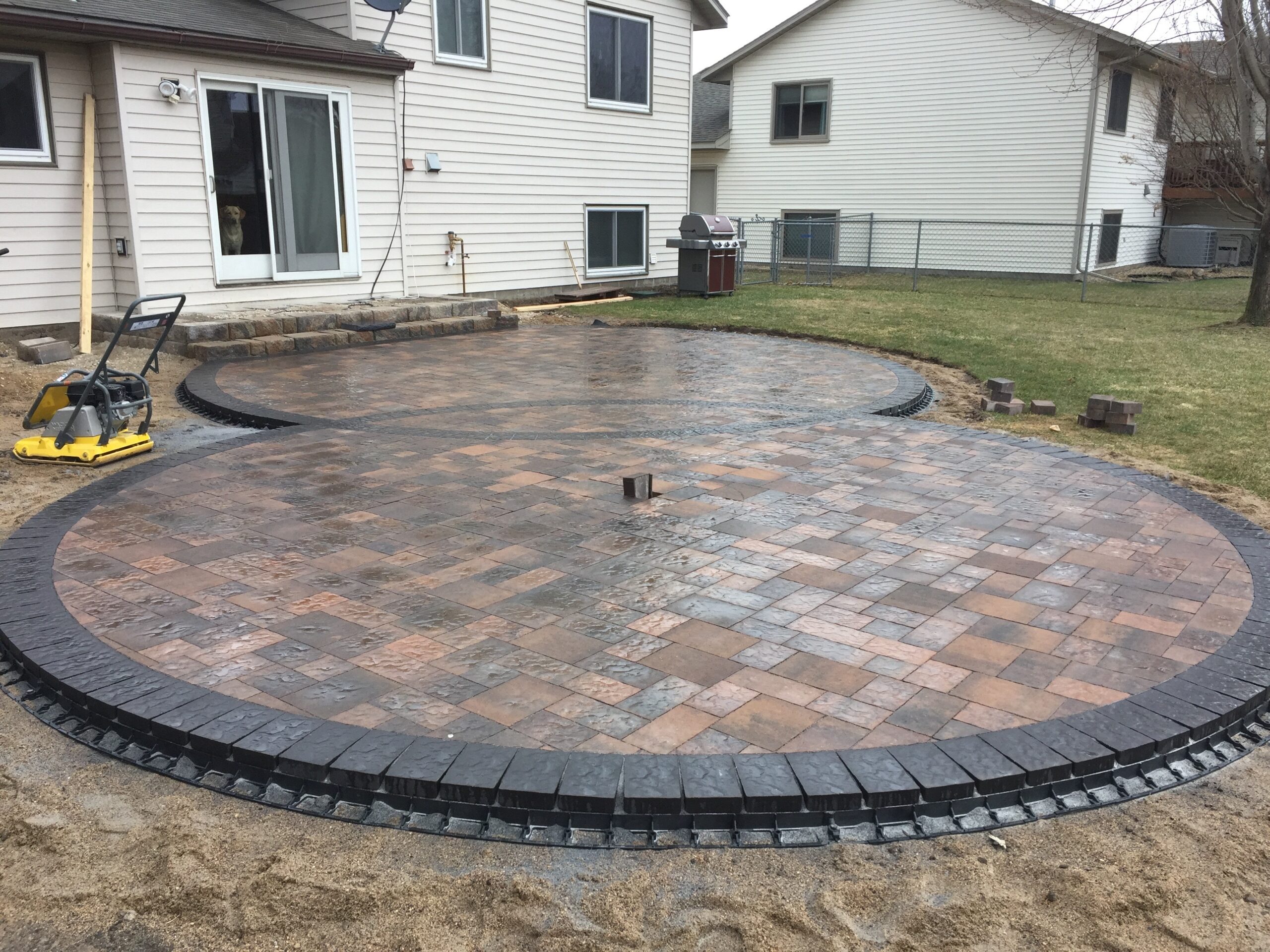 Patio and fire pit project by North Ridge Outdoor Services