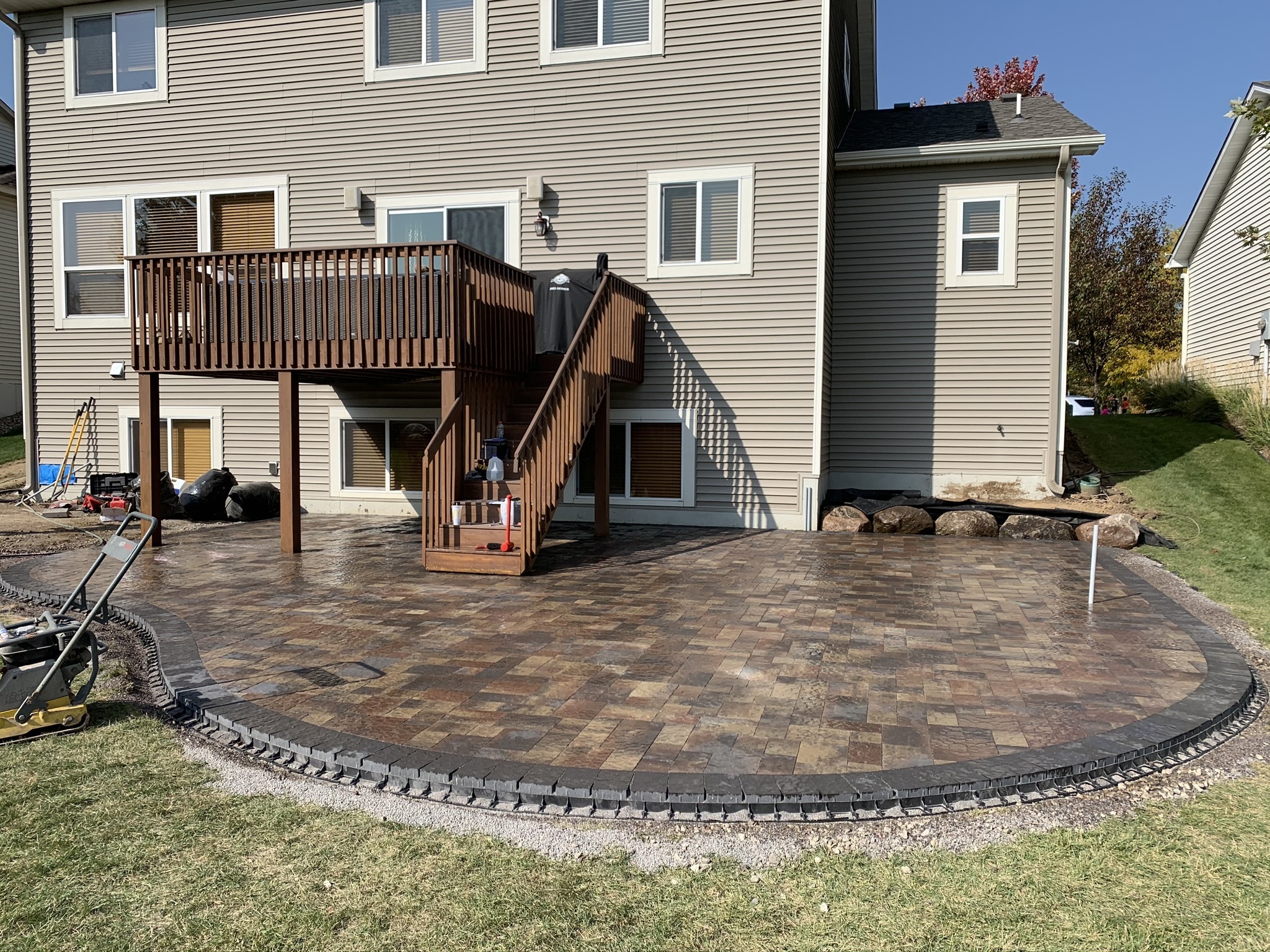 Patio and fire pit project by North Ridge Outdoor Services