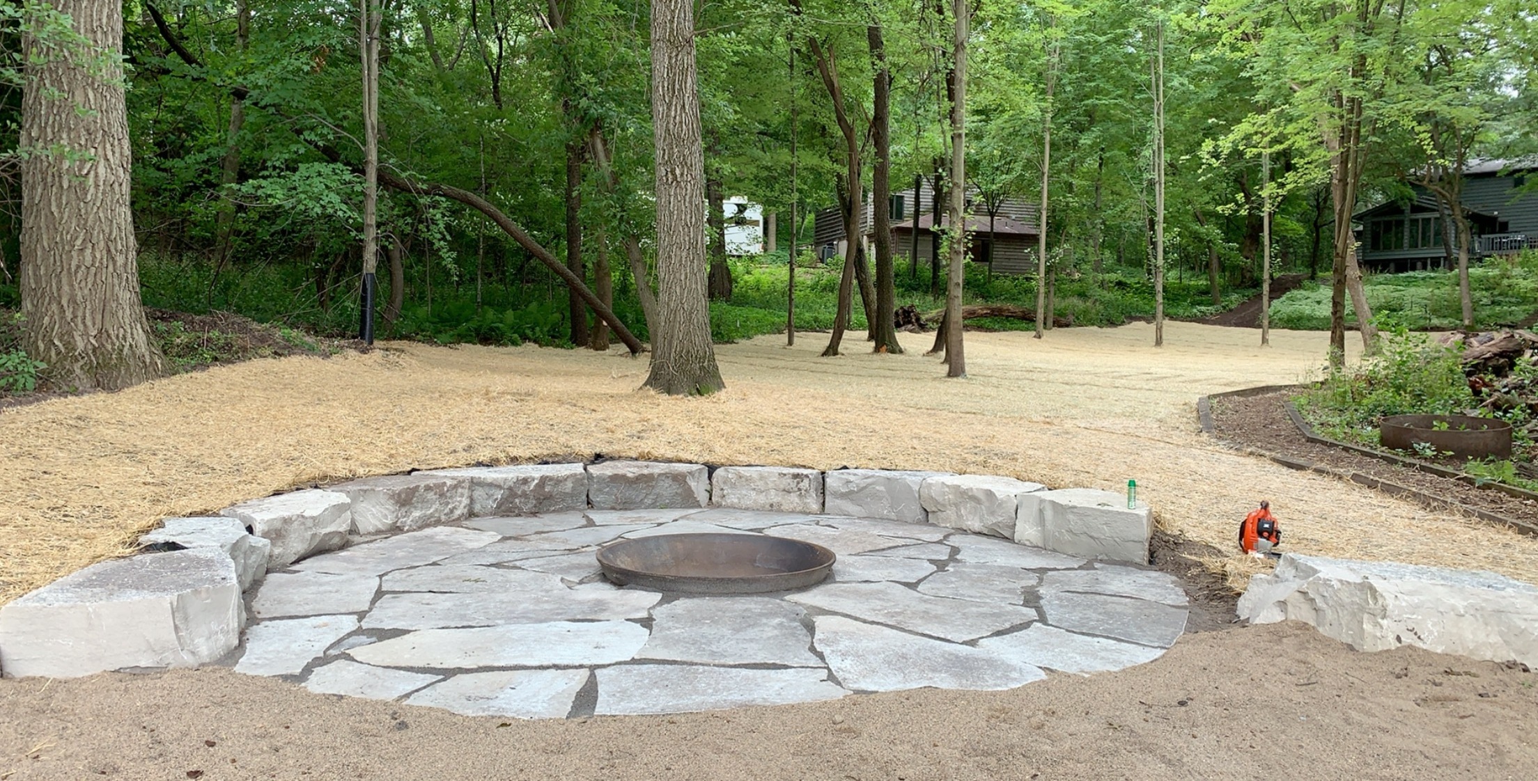 Patio and fire pit project by North Ridge Outdoor Services