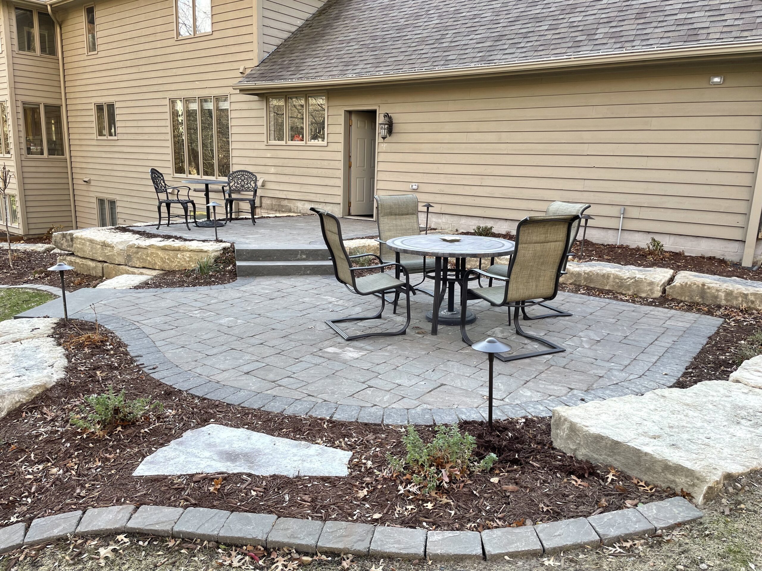 Patio and fire pit project by North Ridge Outdoor Services