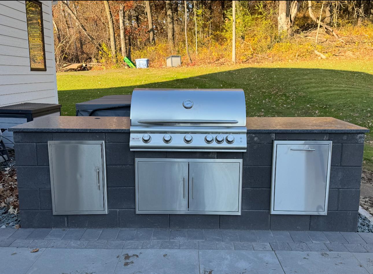 Patio and fire pit project by North Ridge Outdoor Services