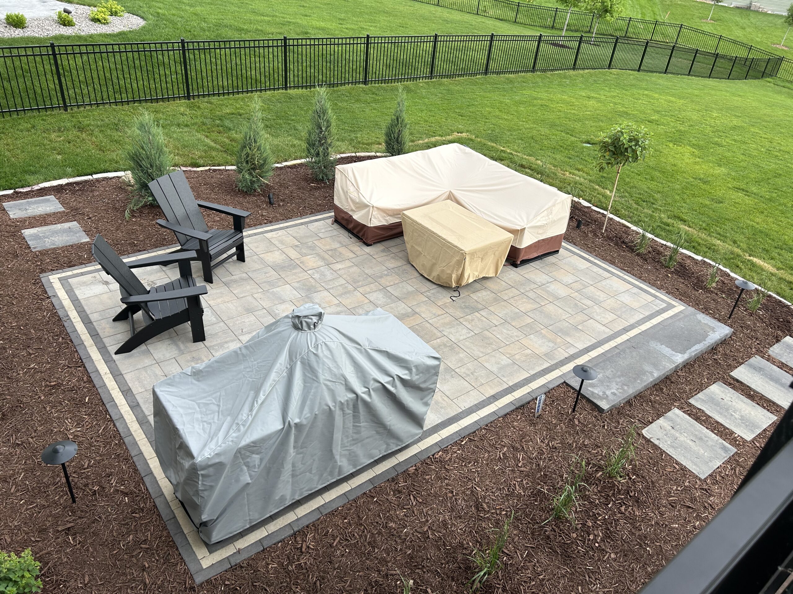 Patio and fire pit project by North Ridge Outdoor Services