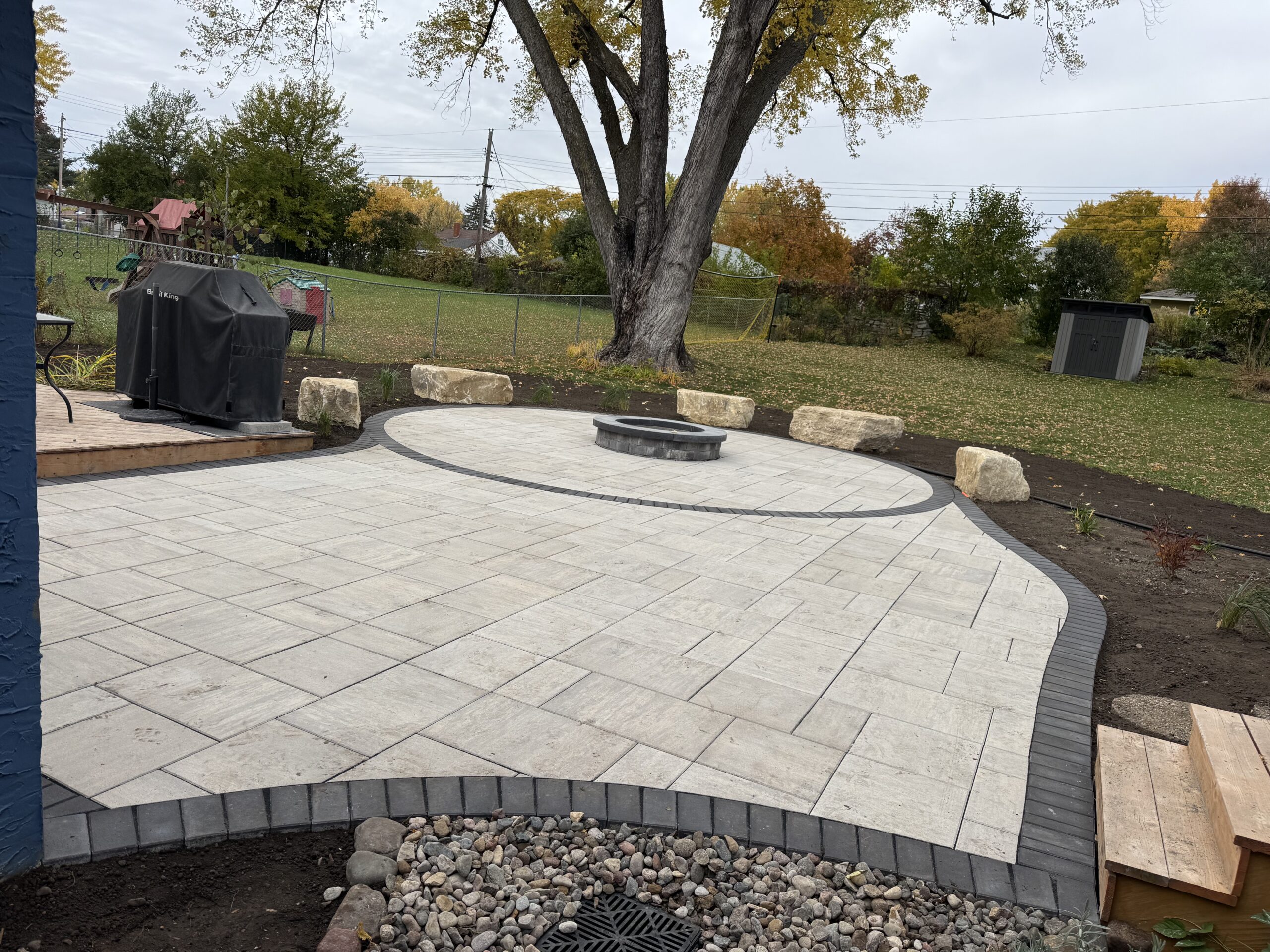 Patio and fire pit project by North Ridge Outdoor Services
