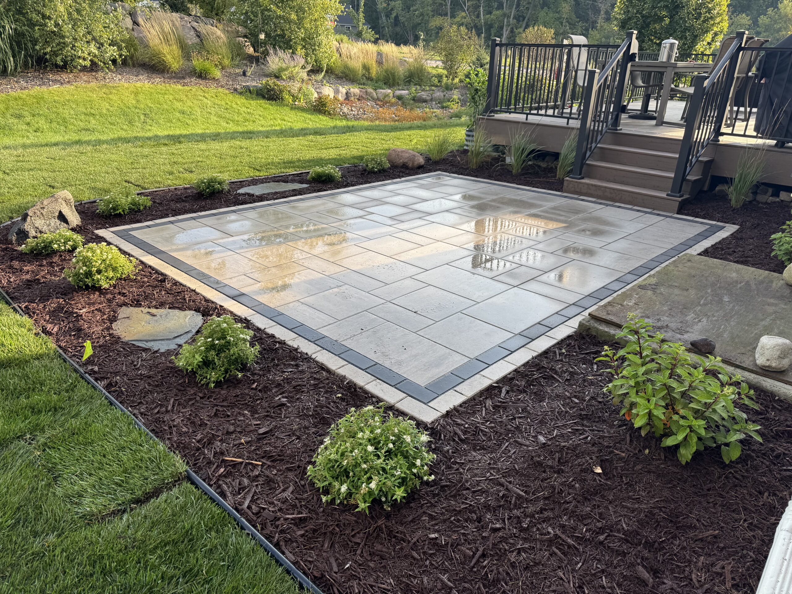 Patio and fire pit project by North Ridge Outdoor Services