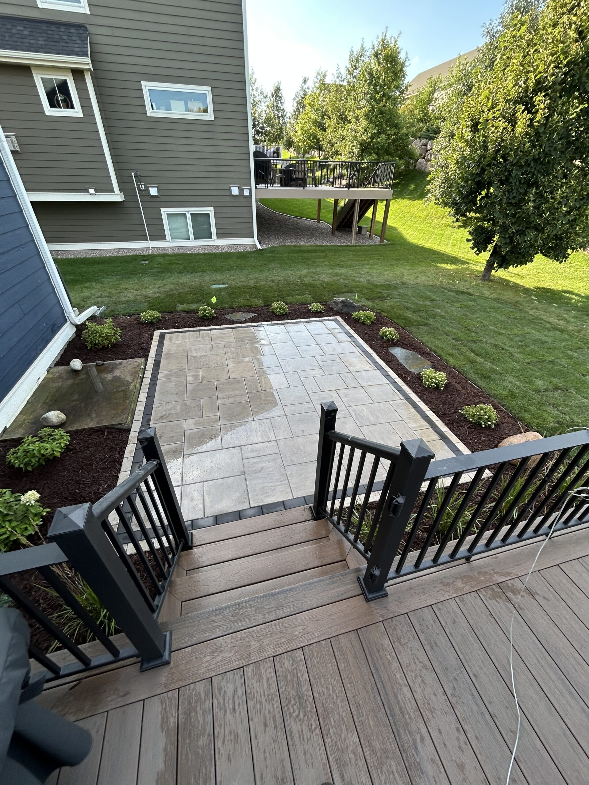 Patio and fire pit project by North Ridge Outdoor Services