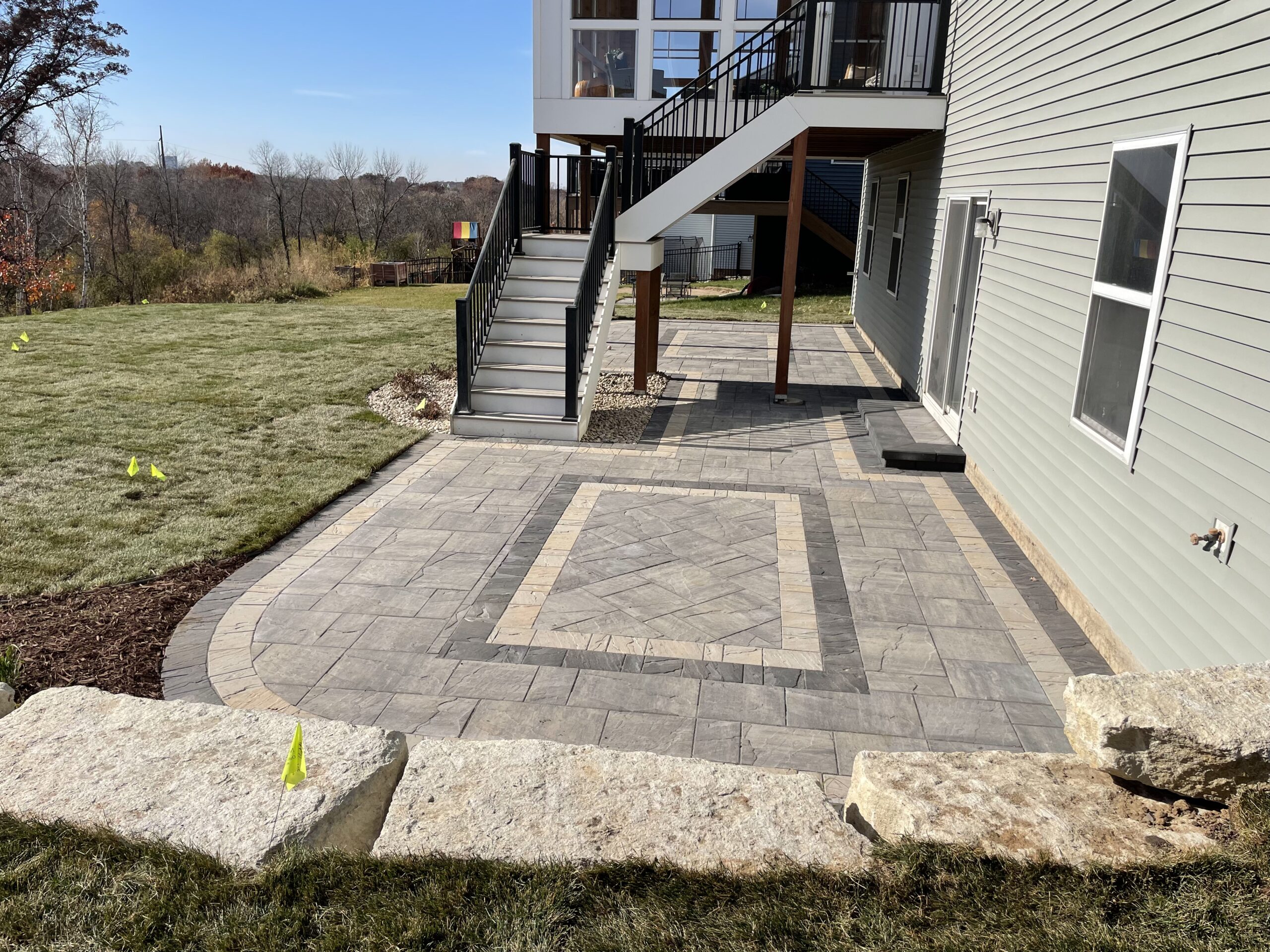 Patio and fire pit project by North Ridge Outdoor Services