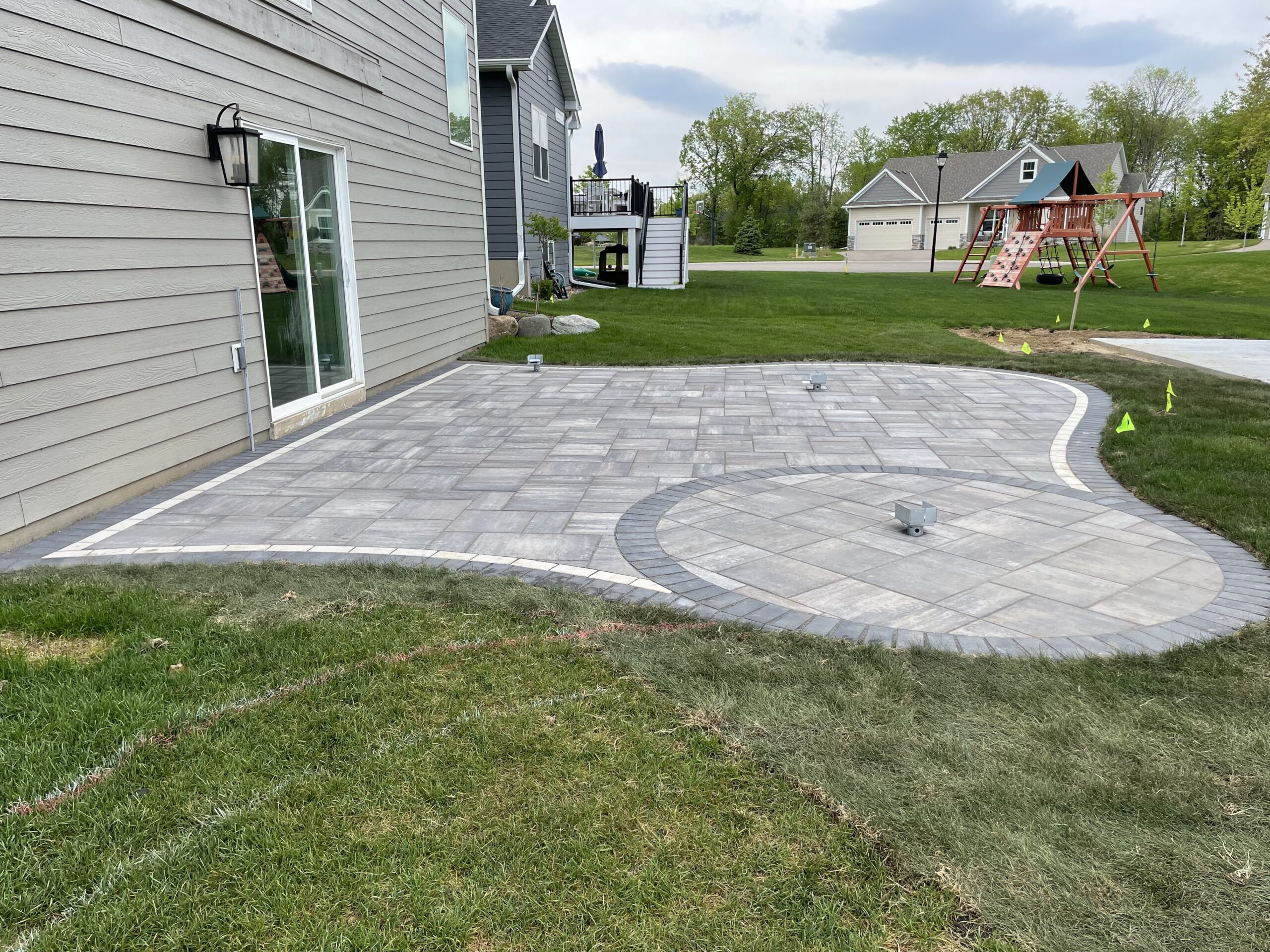 Patio and fire pit project by North Ridge Outdoor Services