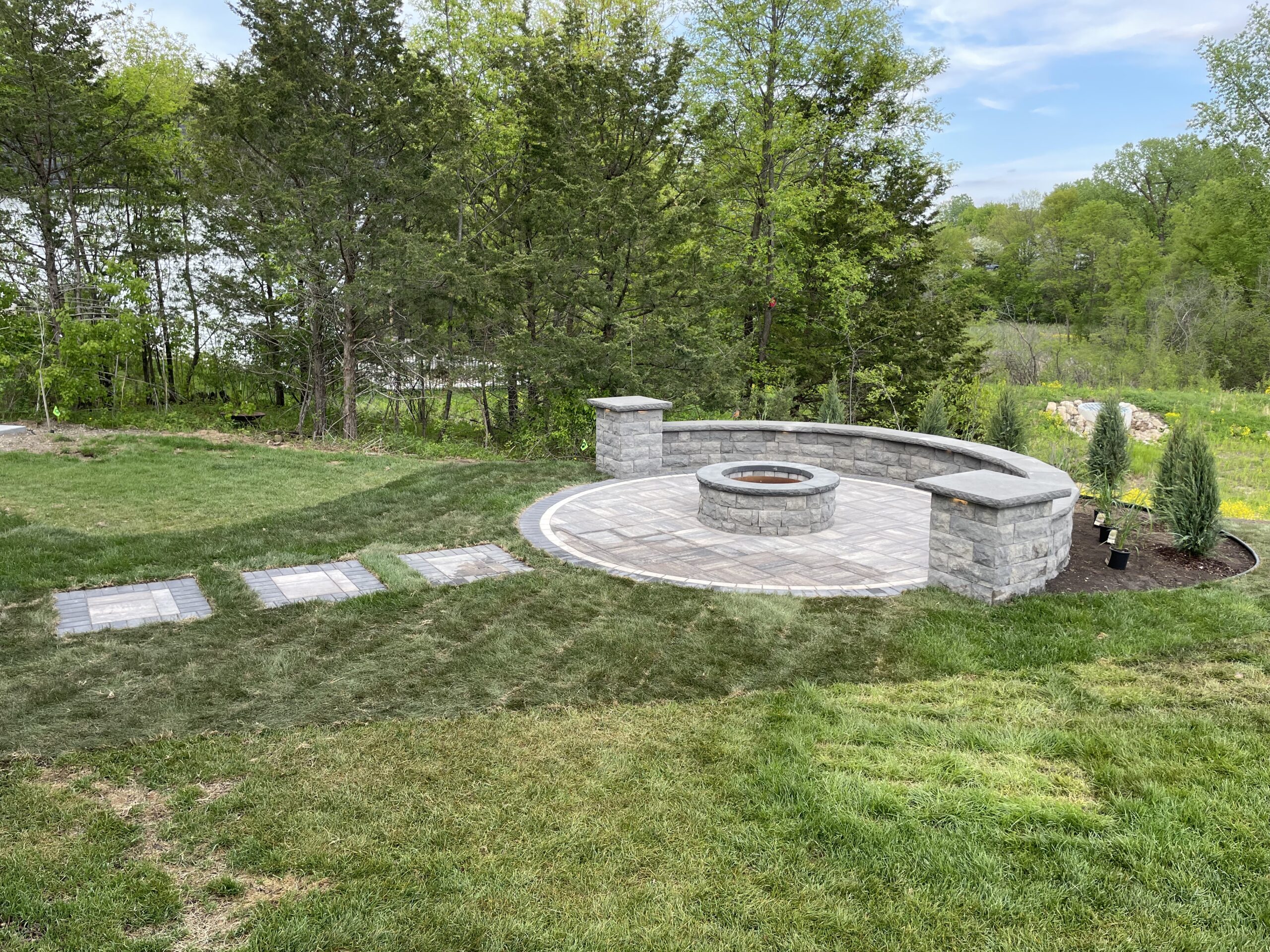 Patio and fire pit project by North Ridge Outdoor Services