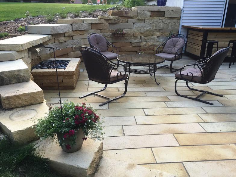 Patio and fire pit project by North Ridge Outdoor Services