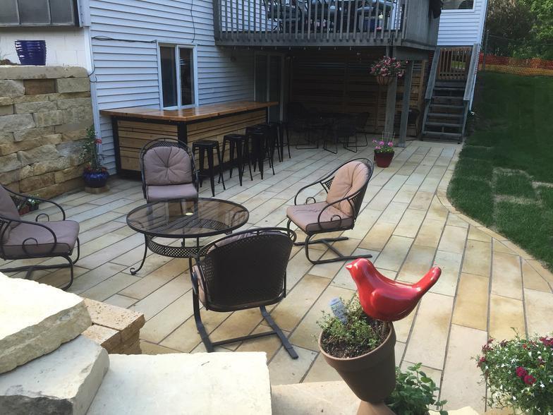 Patio and fire pit project by North Ridge Outdoor Services