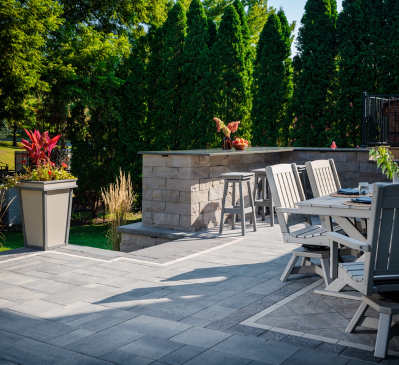 Brisa-style natural stone retaining wall with tiered plantings